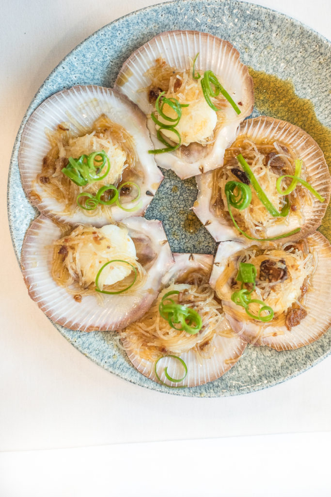 Scallops on half shell with ginger and shallots